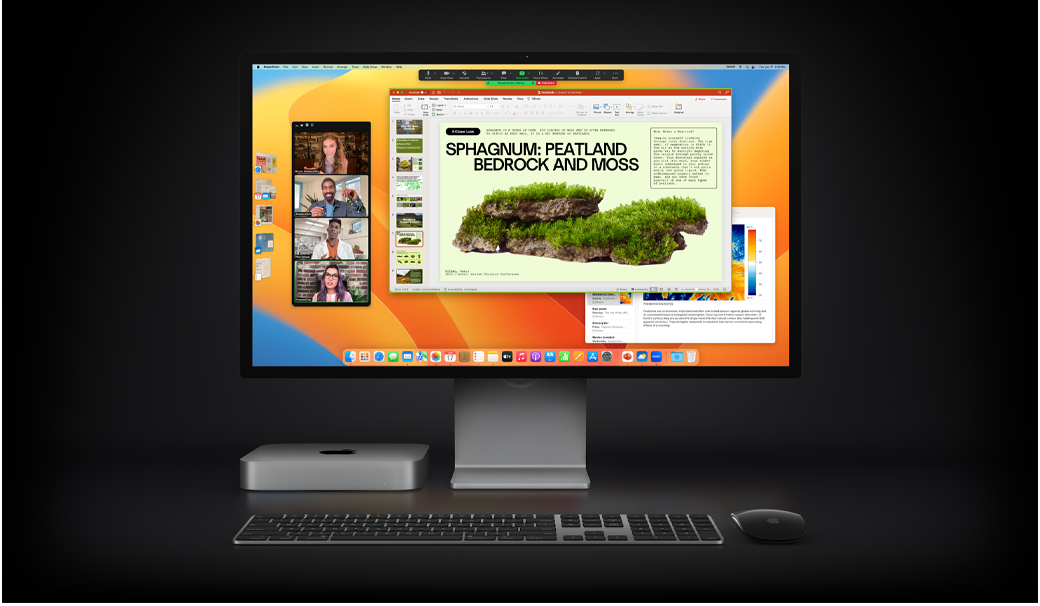 Una Mac mini con un Magic Mouse, un Magic Keyboard y un monitor Studio Display en el que se muestra una presentación de Microsoft PowerPoint compartida a través de Zoom, y la app Notas en segundo plano.